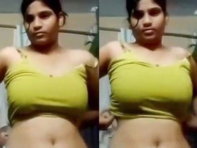 Indian housewife with large breasts changes her outfit