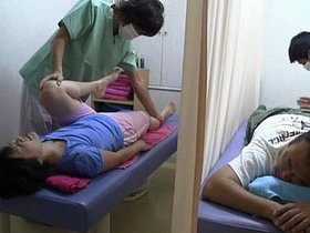 A Japanese wife receives an anal massage with a young man