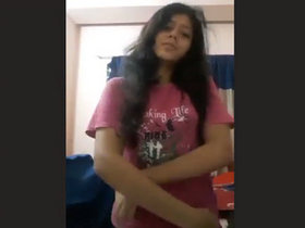 Attractive young woman displays her breasts