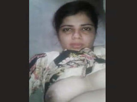 Aroused South Asian housewife pleasuring herself