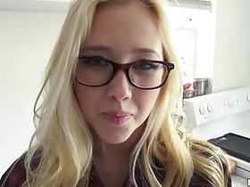 Flaxen-haired shepherdess in glasses, sly in excitement as she screwed up