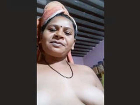 Indian aunty takes nude selfies on camera