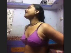 A gorgeous young woman records herself as she satisfies her partner