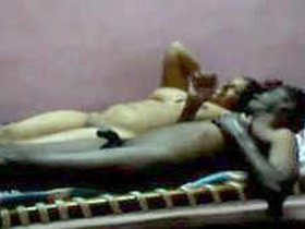 Indian couple unwinds in the nude on the bed after sexual encounter