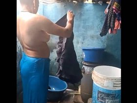 South Asian aunt undresses and misbehaves in the bath