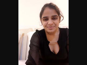 A stunning girl with an adorable face and gorgeous breasts poses nude