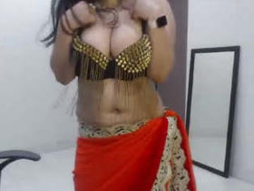 Sexy wife showcases her large breasts and dancing talent
