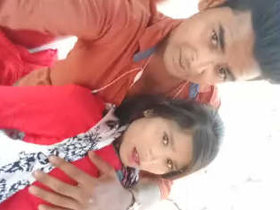 Indian couple kisses and fondle breasts in open-air setting with Hindi soundtrack