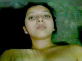 Indian woman undresses for a bath