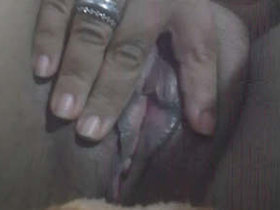 Indian wife indulges in self-pleasure by fingering her intimate area