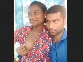 Indian woman with large breasts gets hugged by her partner
