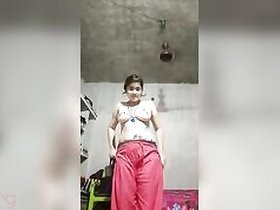 Desi girl makes a solo video of herself undressing under a fan