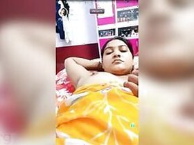 Fatty Desi poses in an XXX video with a young man who plays with her tits