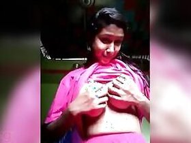 Desi girl in pink plays with her own tits and nipples in MMC video