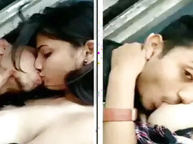 Young amateur couple kissing and sucking tits