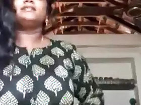 A sexy mallu aunt undresses, showing her tits...