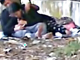 Sexy couple makes her suck it in a public park