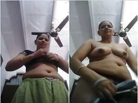 Desi Bhabhi undresses her Sari and shows off her pussy with big tits